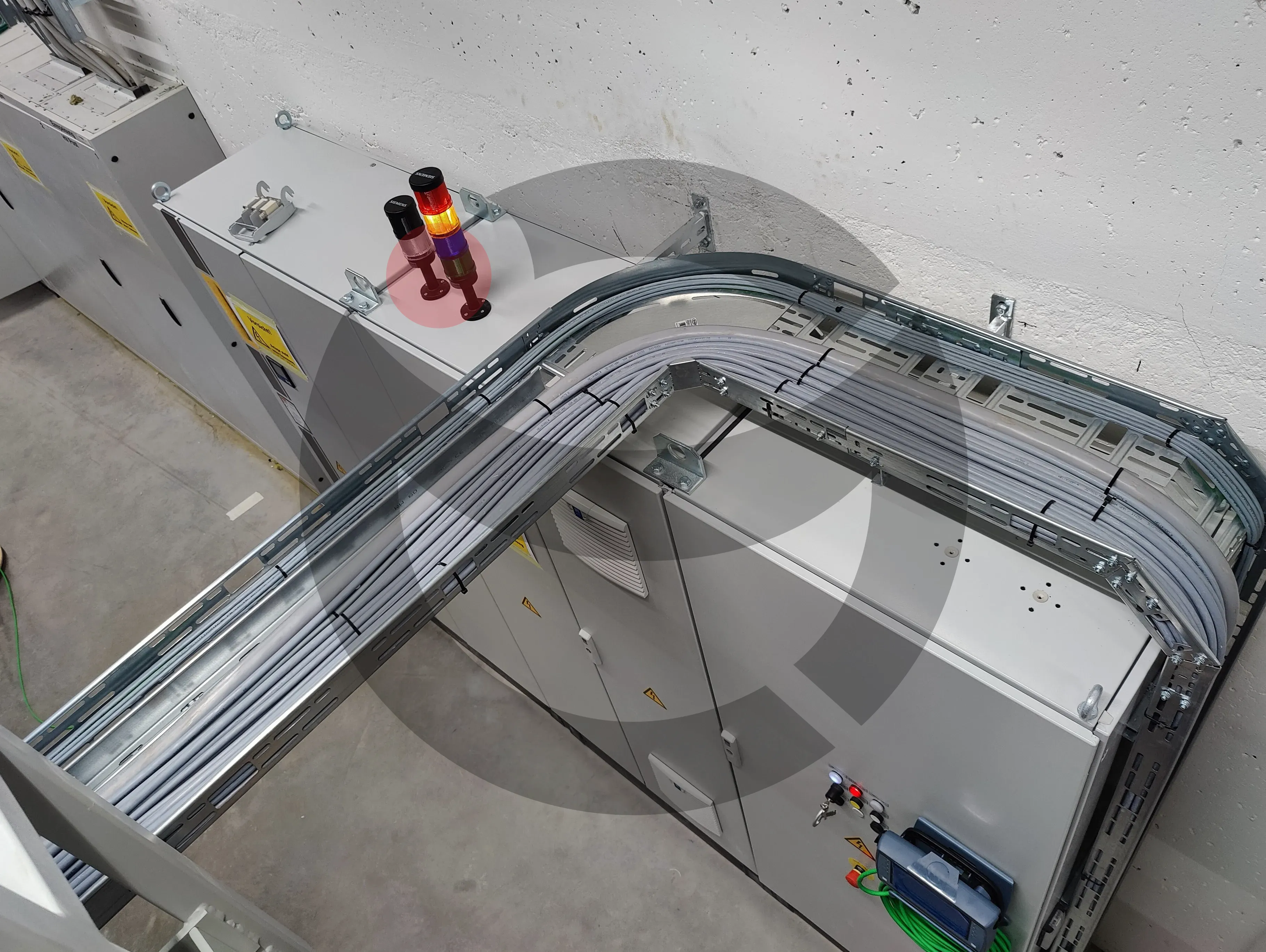 Precision industrial cable management with 90-degree tray bends and uniform ties