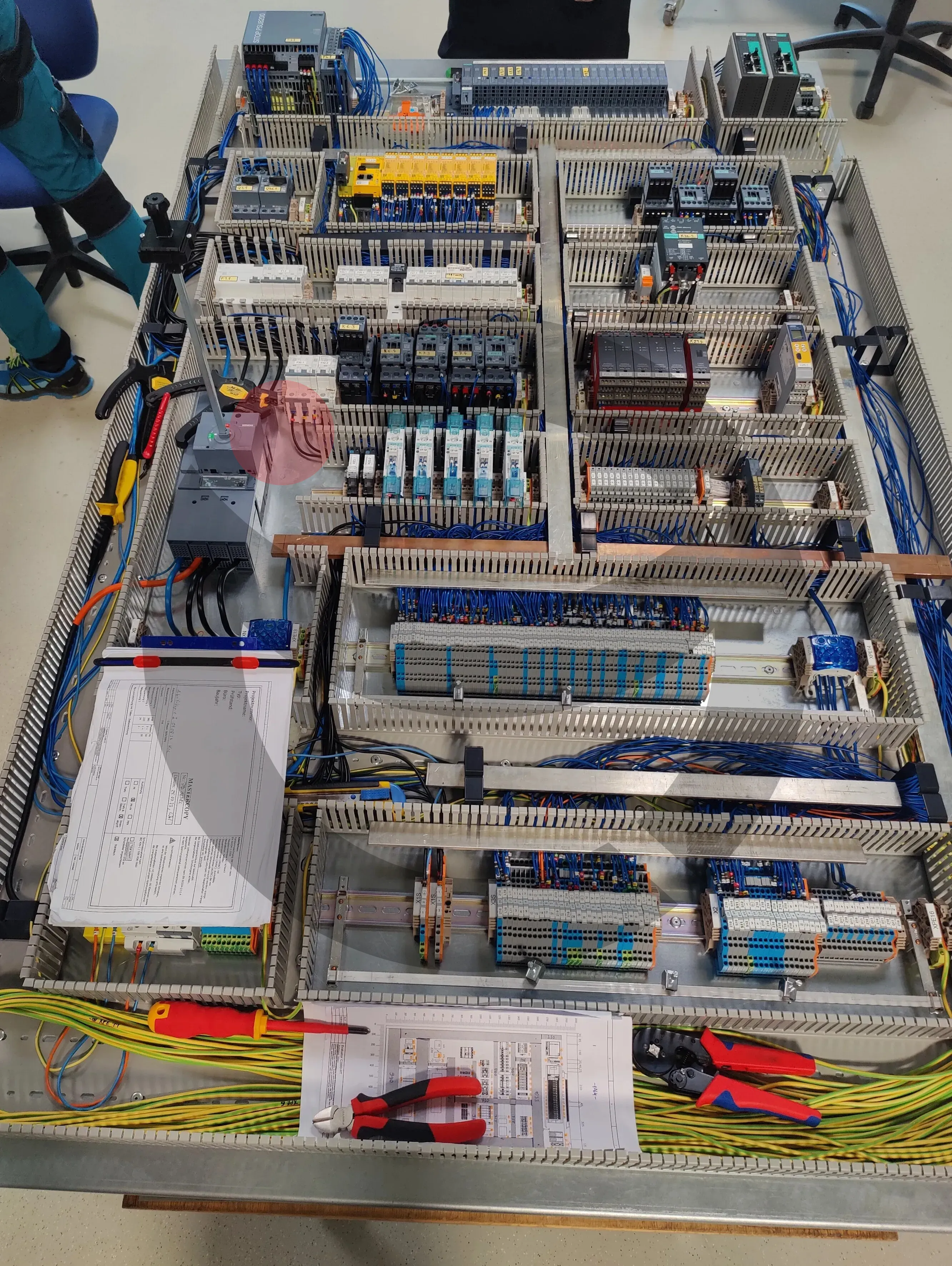 Control panel assembly and precision pre-wiring on DIN rails