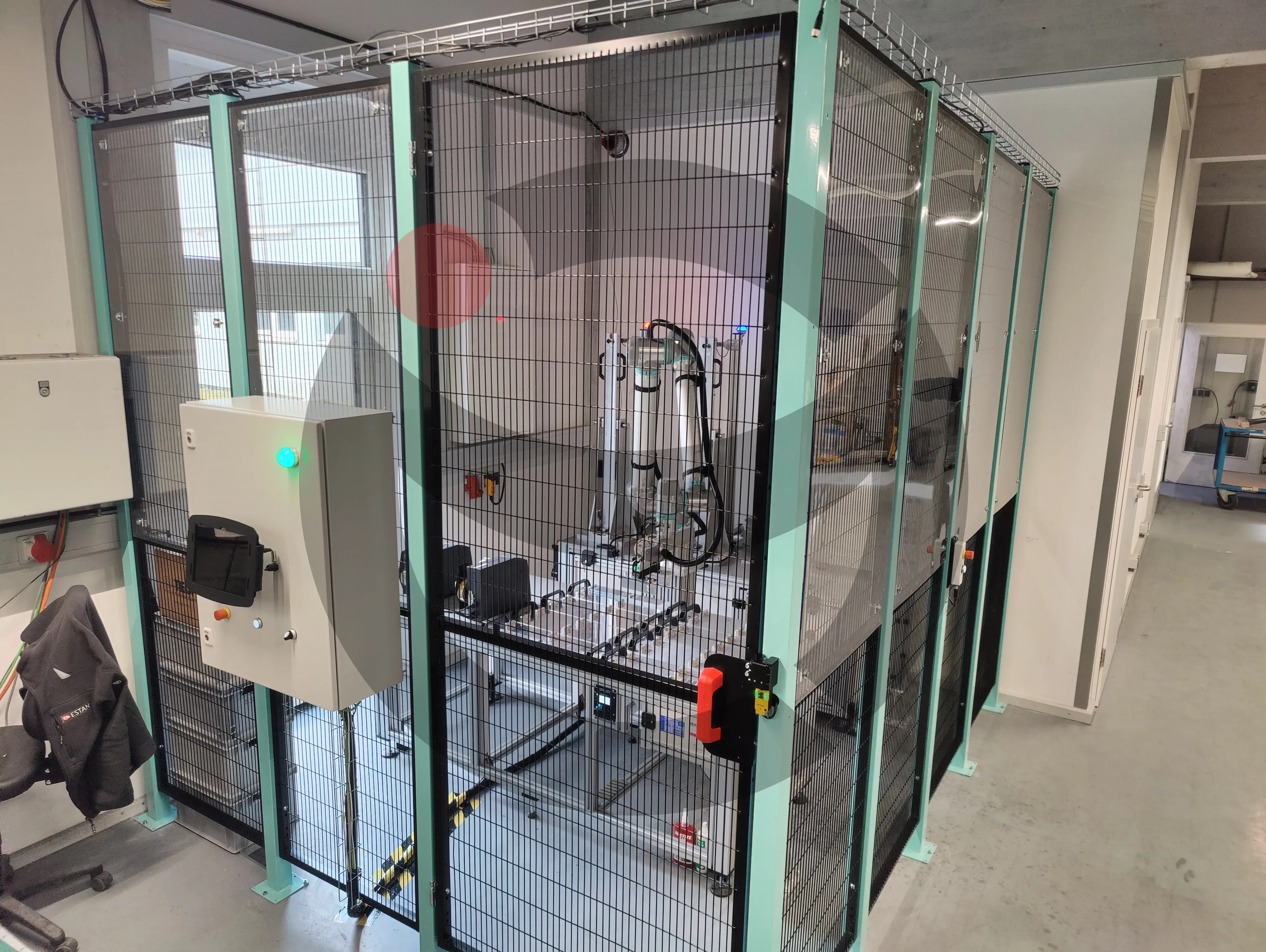 Turnkey robotic welding cell with overhead cable routing and safety interlocks