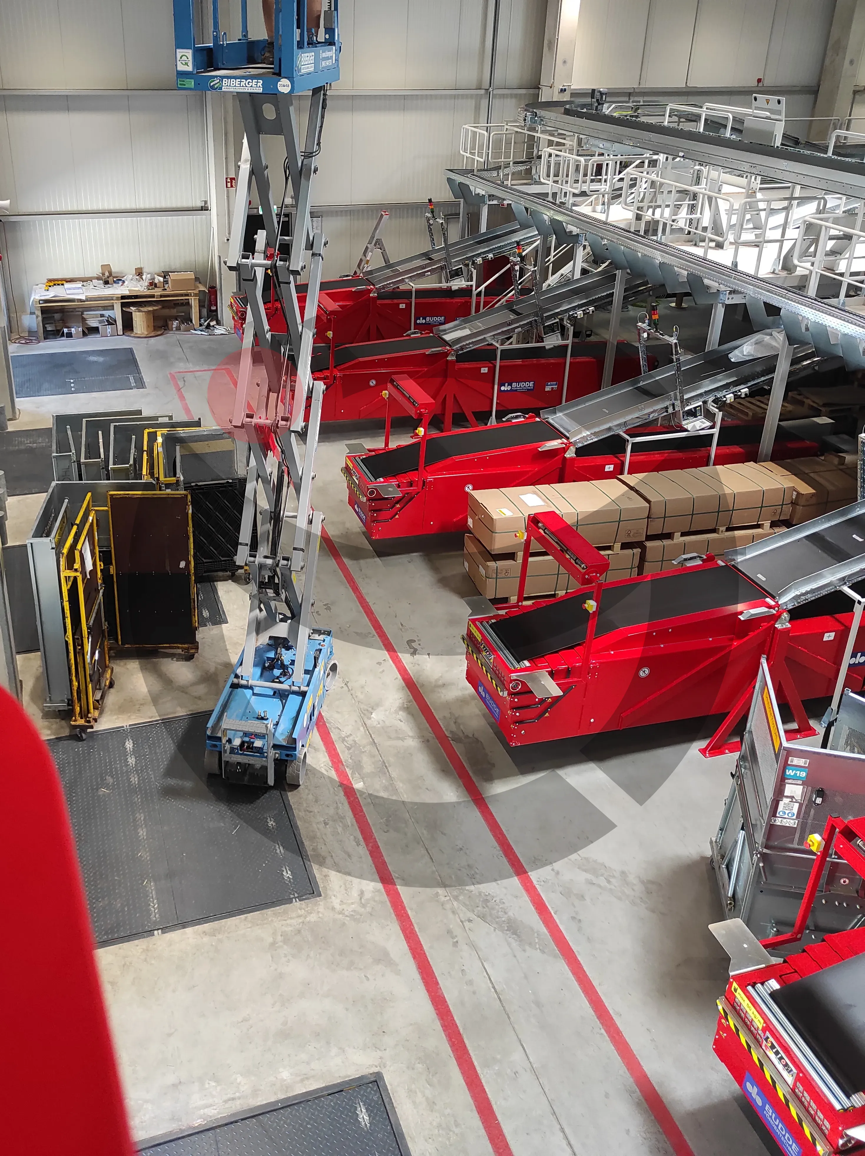Overhead cable ladder installation from scissor lift at high elevations
